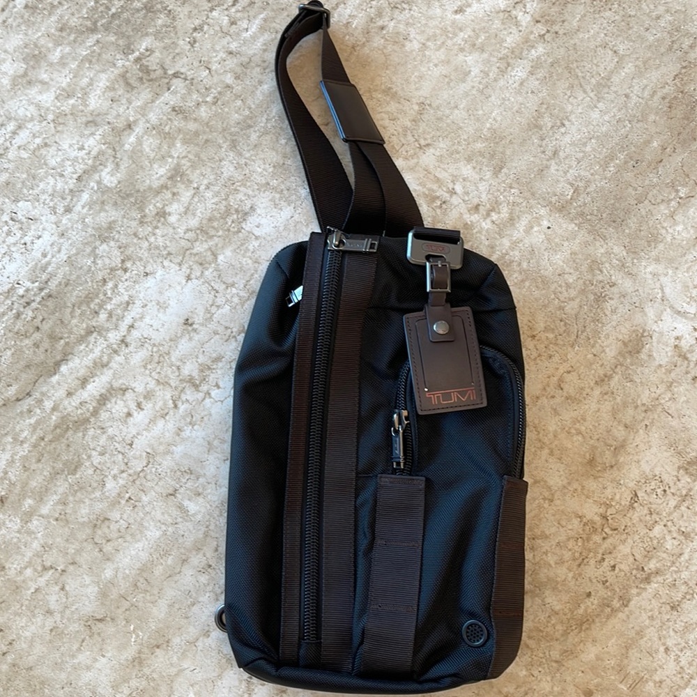 Tumi canvas sling bag. NWOT